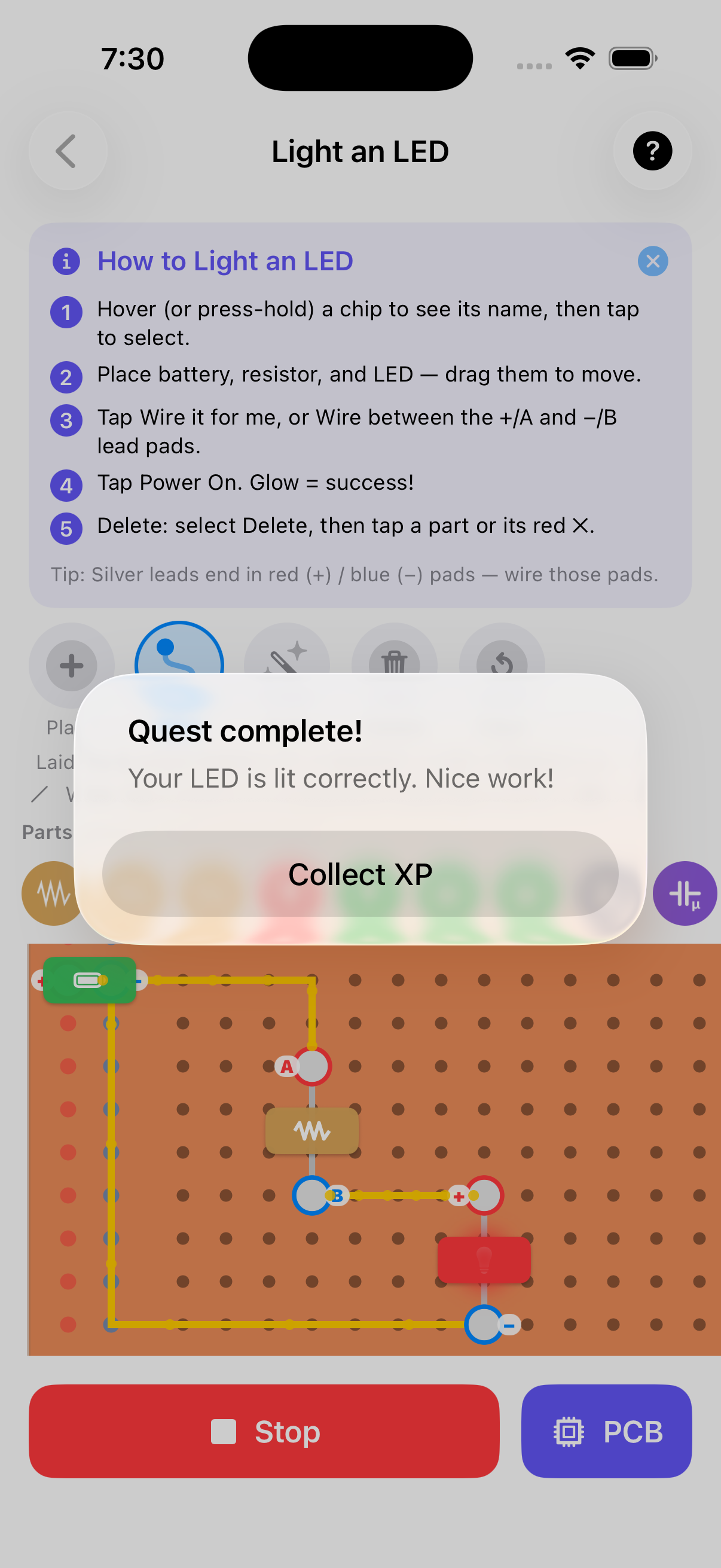 CircuitQuest virtual breadboard with a lit LED and quest-complete modal